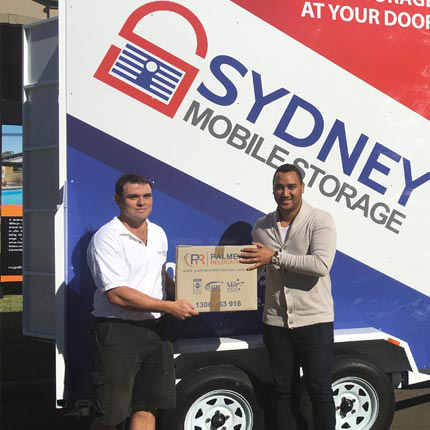 Two Removalists Packing A Sydney Mobile Storage Taxibox